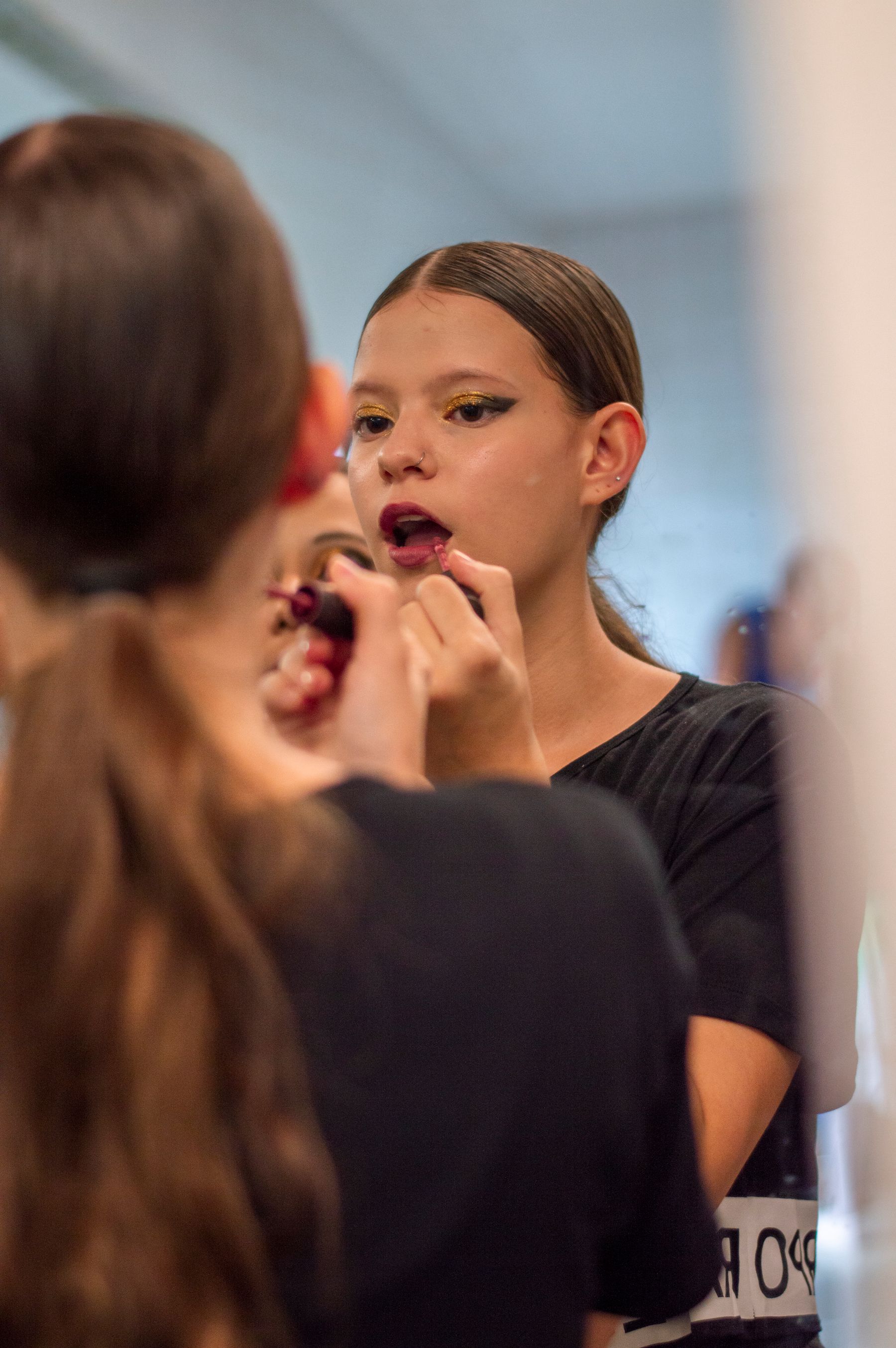 Lipstick being applied with a brush