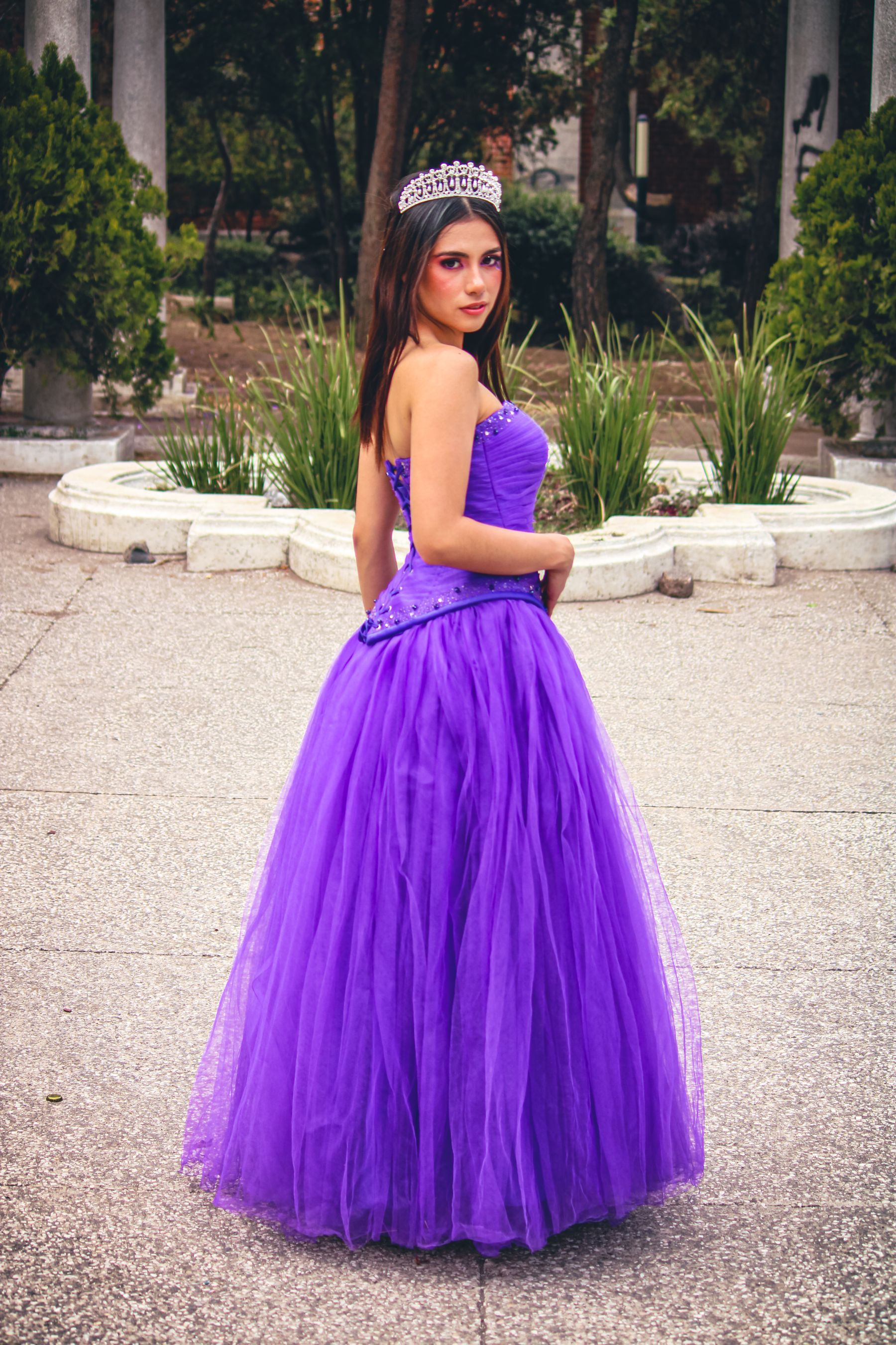 Matric dance guest in a purple ball gown